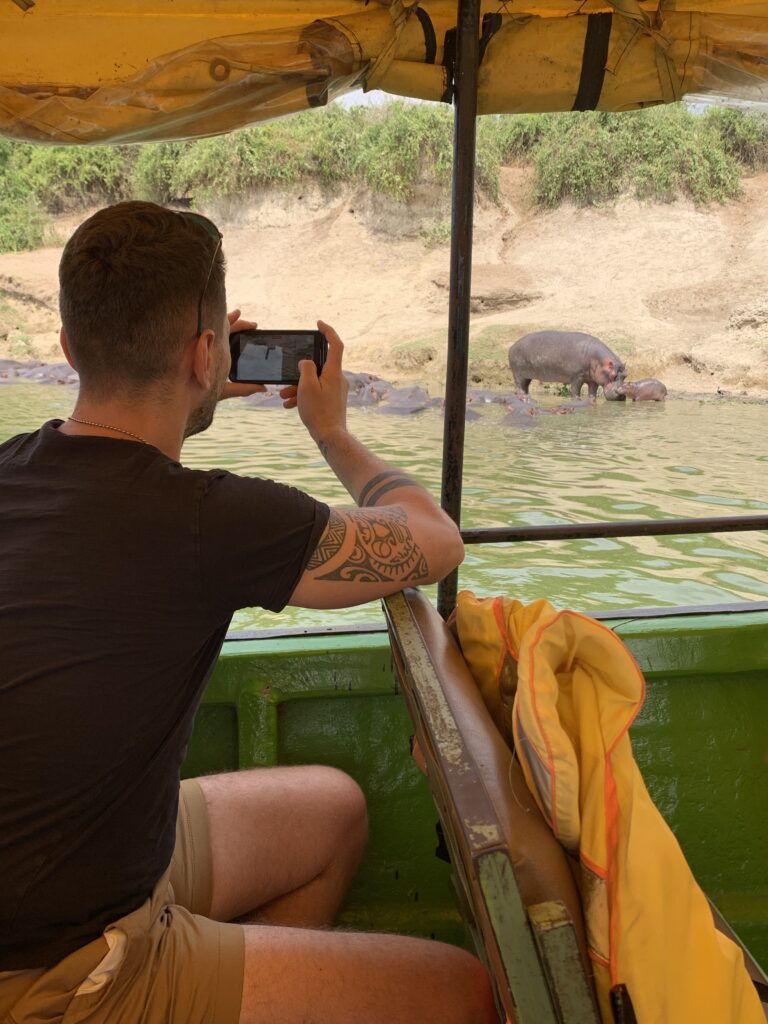 taking photos of hippos on kazinga channel
